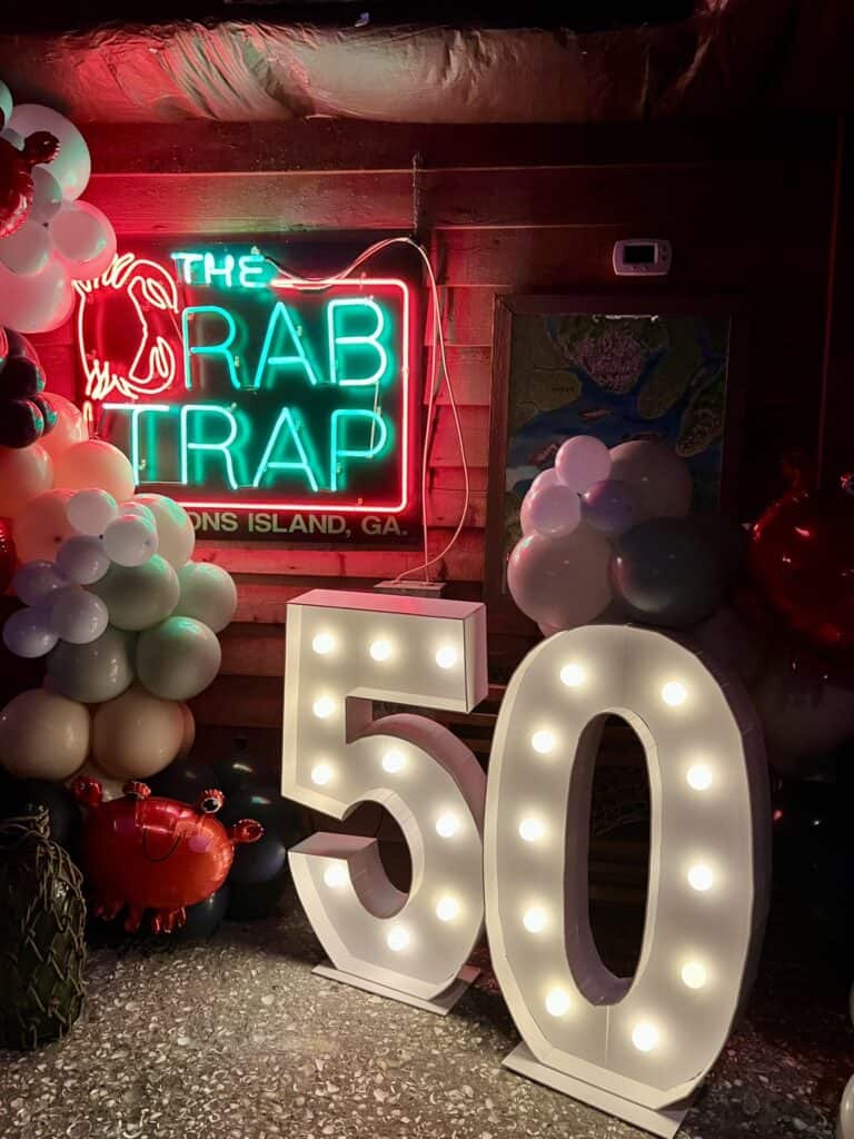 Lit sign for the Crab Trap Restaurant's 50th Anniversary. 
