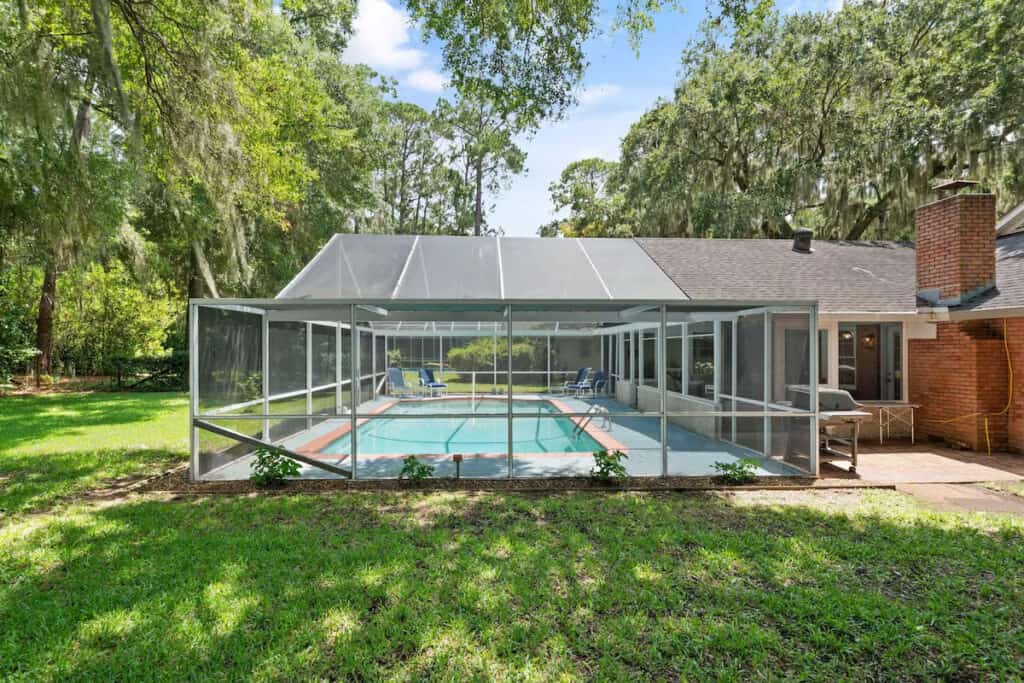 swimming pool with screened lanai. 