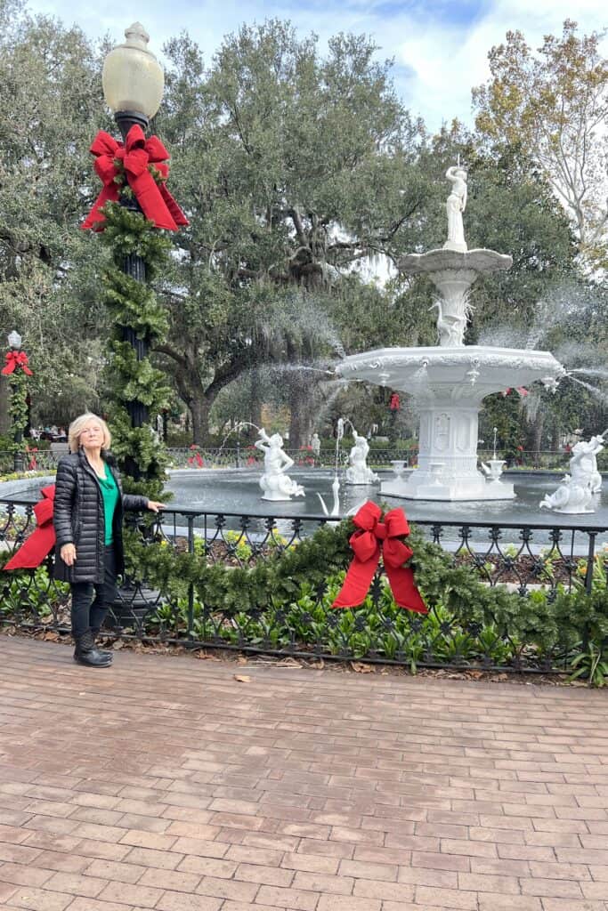 Pam in front of Forsyth Park fountain at Christmas.