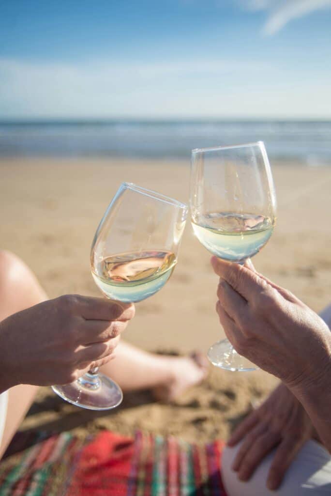 wine cheers on the beach