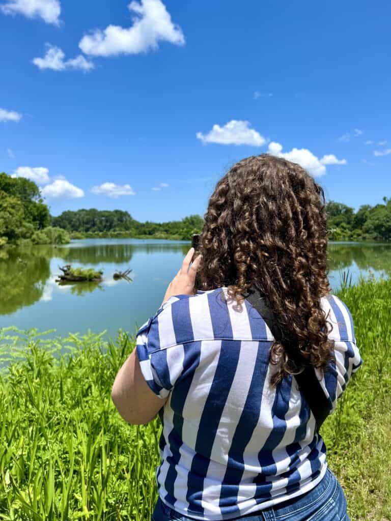 girl taking photo at Harris Neck Wildlife Refuge.