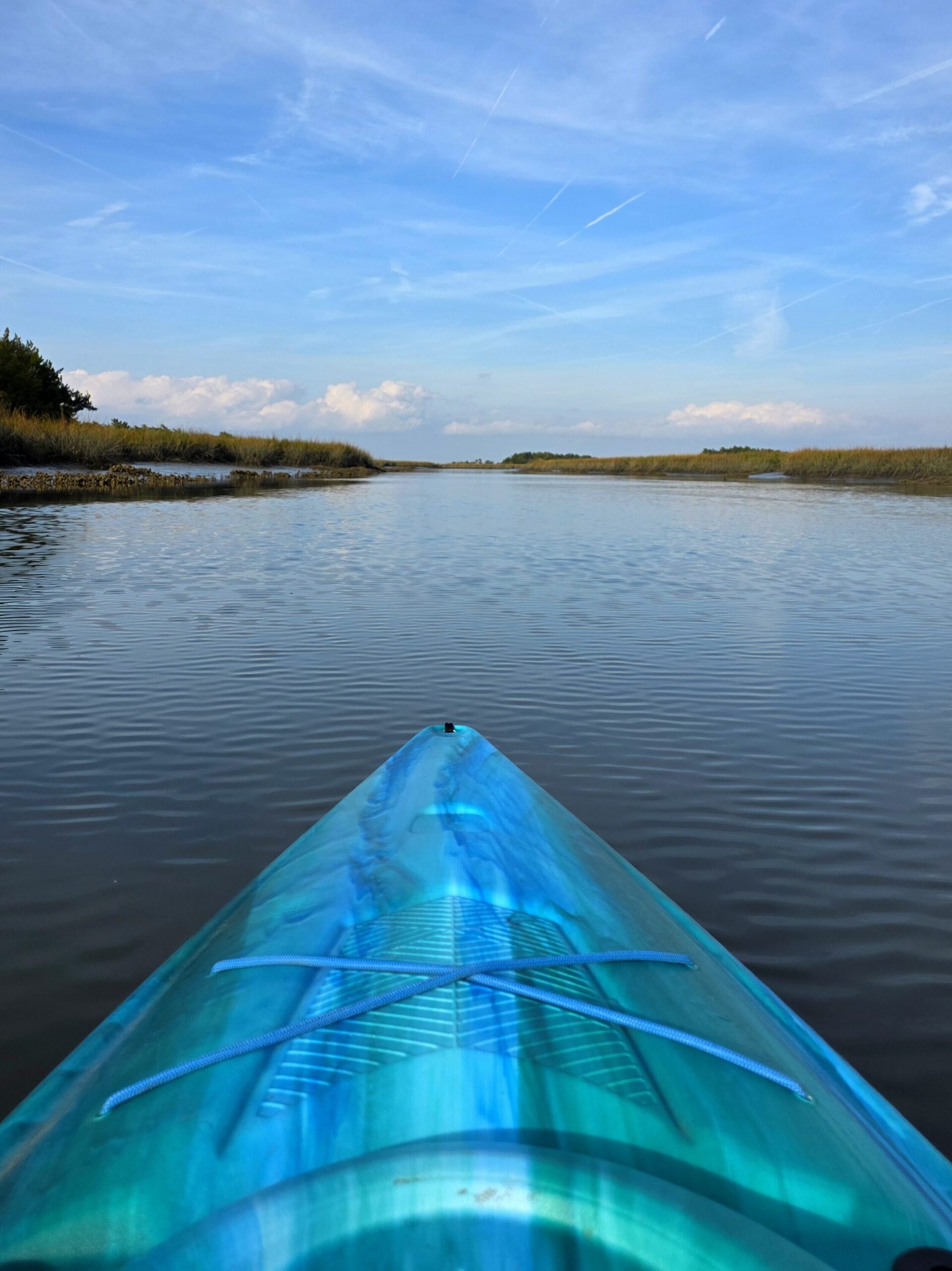 a blue kayak on the water in Brunswick, GA. 
