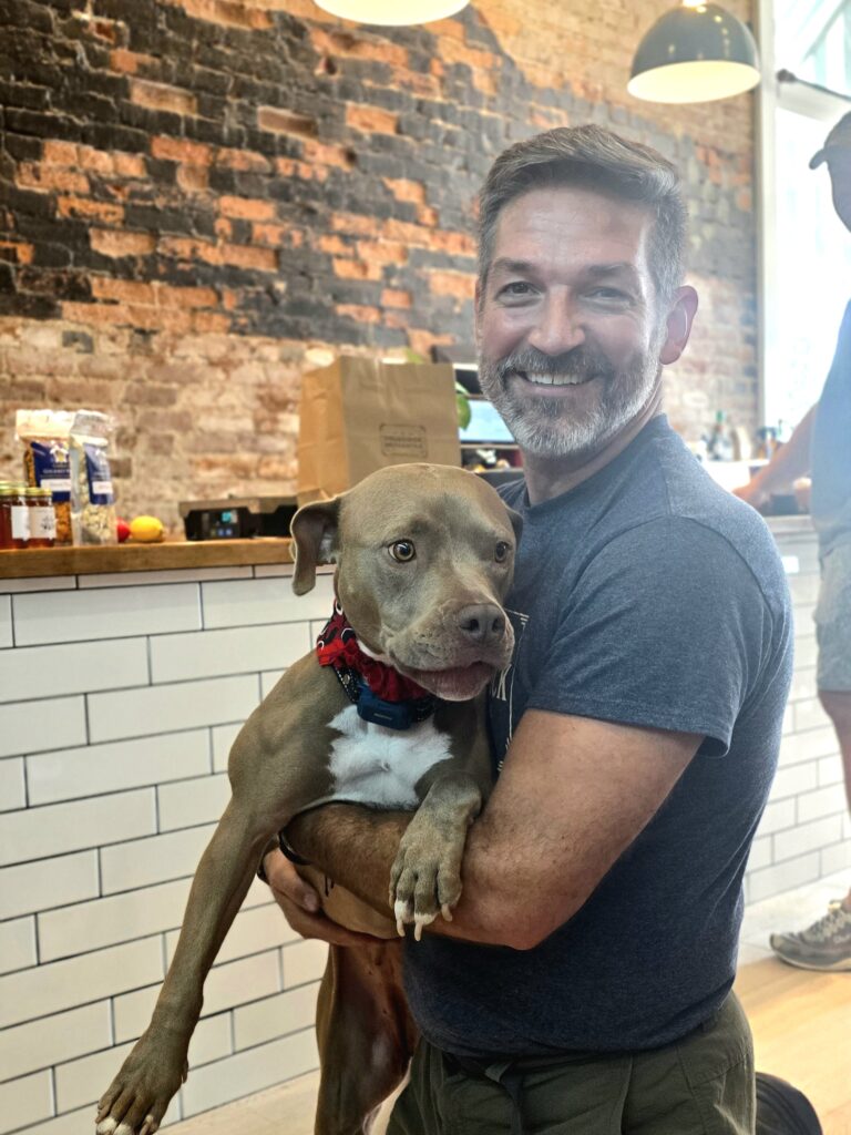 Zach Siler of Brunswick Mercantile with his dog, Bentley Grylls.